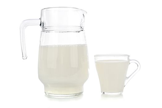 Glass and jug of fresh milk isolated on white background.