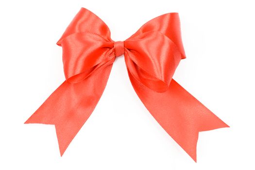 Shiny red satin bow on a white background in close-up ( high details)