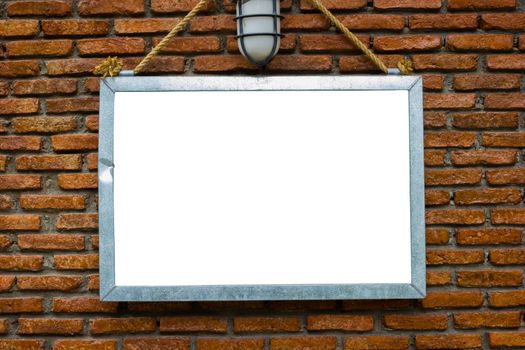 blank billboard hung on a buildings exterior brick wall, dark tone background