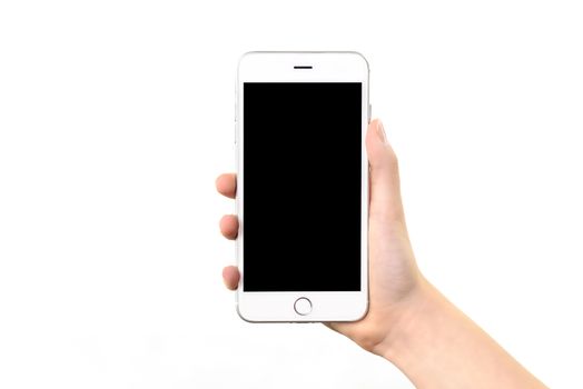 Mockup of a generic modern white and silver digital smartphone in woman hand and isolated on a white background.