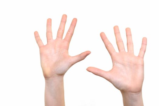 Caucasian white girl is showing her hands with open palms on a white background in close-up