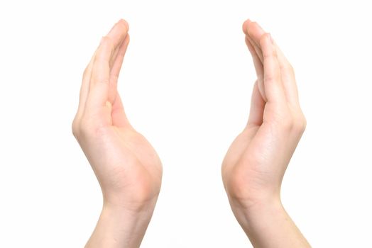 Female hands raised up in a gesture of holding something or praying on a white background in close-up