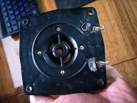 Speaker repair, disassembled speaker. High-frequency speaker 10gdv-2-16 on a white background. A component of a three-way speaker system.