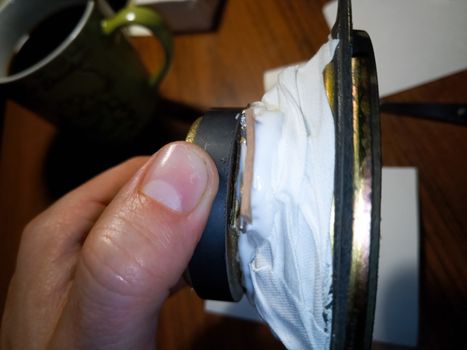 Speaker wrapped in adhesive tape. creating tweeter from a broadband.