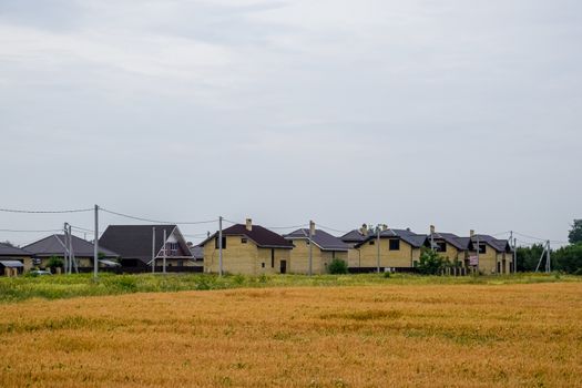 A cottage village of two-storey houses. Low-rise development.