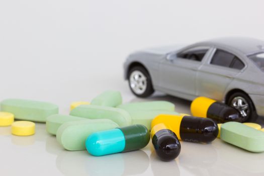 horizontal photo of medicine with blurred gray car on the background