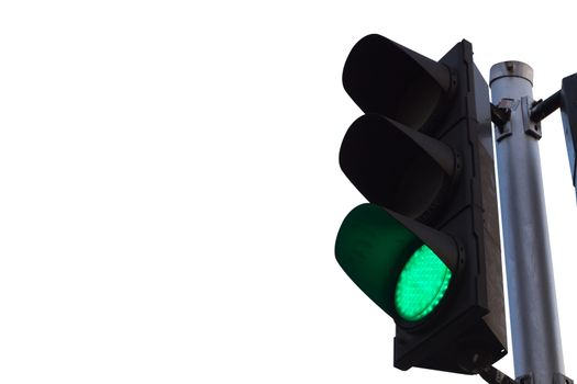 green color on the traffic light isolated on white background.