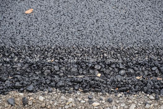 New fresh asphalt. edge of the new road from the asphalt.