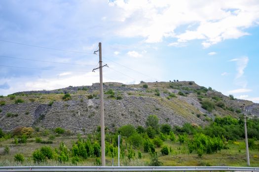 ore slag dumps after processing. Old stepped terricon in the form of a hill with terraces