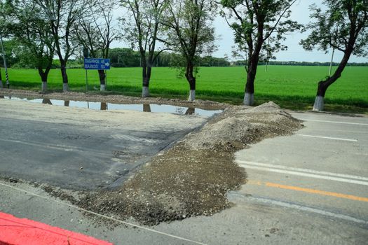 Road repairs, a pile of old cut asphalt.