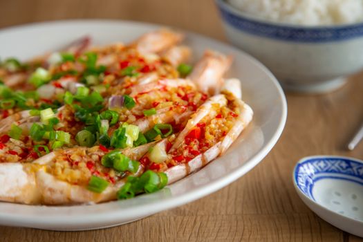 steam prawn with garlic and chilli on wooden background