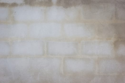 Plaster and cement urban wall background with the texture of brick inside