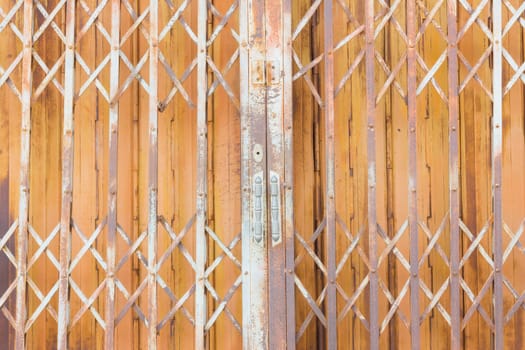 Old rusty steel vintage shutter door texture pattern and background, Thailand