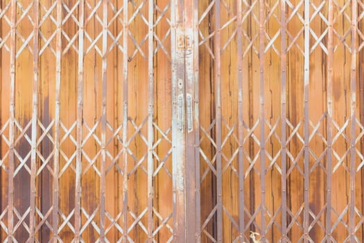 Old rusty steel vintage shutter door texture pattern and background, Thailand