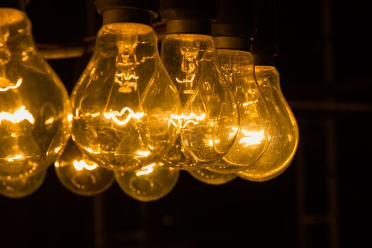 old vintage light bulbs  in the night with copyspace on the right