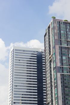 Top of high-rise business office building on blue sky in Bangkok Thailand