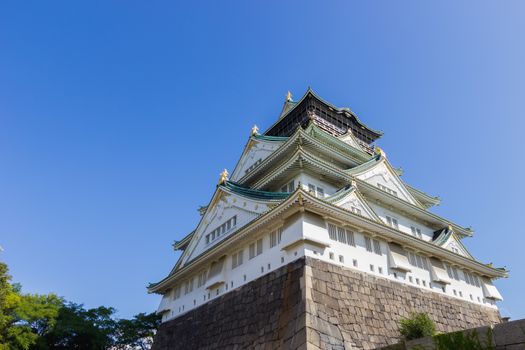 Osaka castle on clear blue sky with copyspace