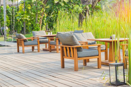 modern chair and table on wooden floor at coffee shop in Thailand