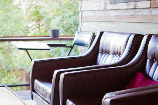 close-up brown sofa in wooden house with copyspace