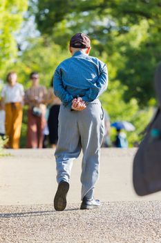 lonely asian old man walking in the park