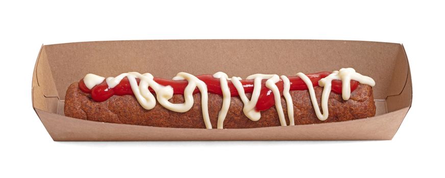 One frikadel with ketchup and mayonnaise, a Dutch fast food snack on a paper tray