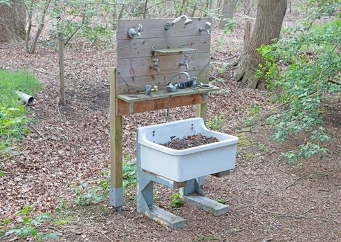 Funny tap faucet, in the middle of the forest