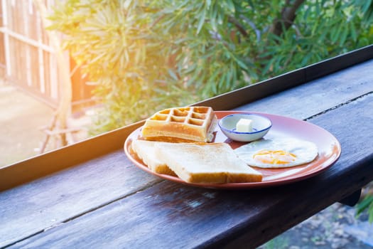 breakfast set of hotel in Thailand on wooden table