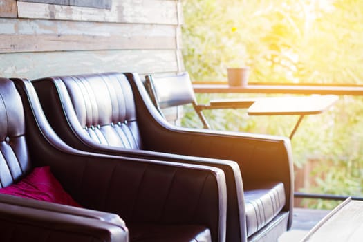 close-up brown sofa in wooden house with copyspace