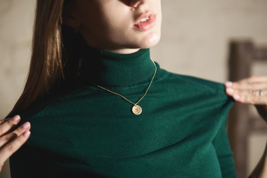 Portrait of beautiful fair young woman with fashion jewelry, one light source