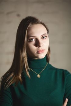 Portrait of beautiful fair young woman with fashion jewelry, one light source
