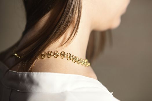 Portrait of beautiful fair young woman with fashion jewelry, one light source