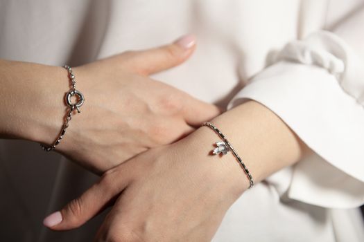 Portrait of beautiful fair young woman with fashion jewelry, one light source