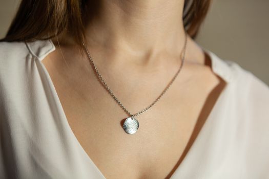 Portrait of beautiful fair young woman with fashion jewelry, one light source