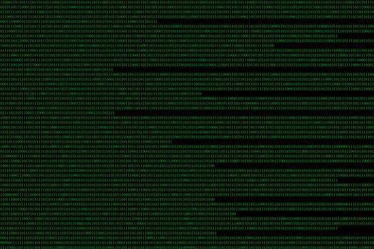 green binary computer code on black background