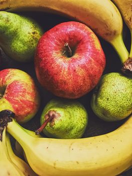 Organic apples, pears and bananas on rustic linen background, fruits farming and agriculture