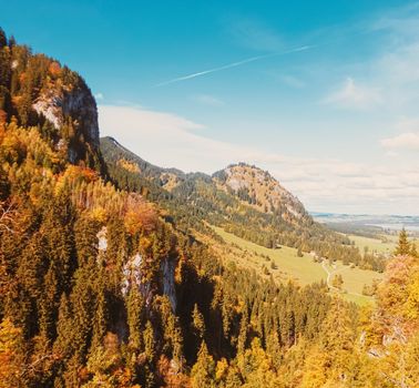 Beautiful nature of European Alps, landscape view of alpine mountains, lake and village in autumn season, travel and destination scenery