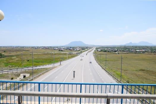 The road crossing is adjacent to the secondary road.