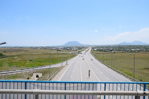 The road crossing is adjacent to the secondary road.