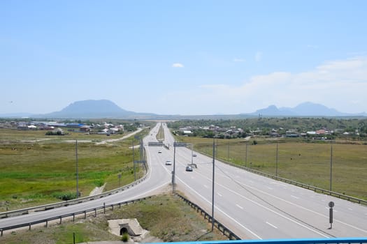 The road crossing is adjacent to the secondary road.
