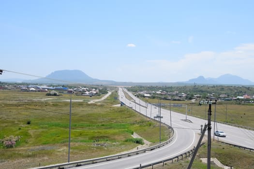 The road crossing is adjacent to the secondary road.