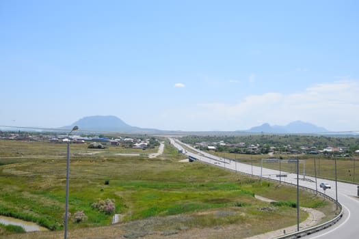 The road crossing is adjacent to the secondary road.