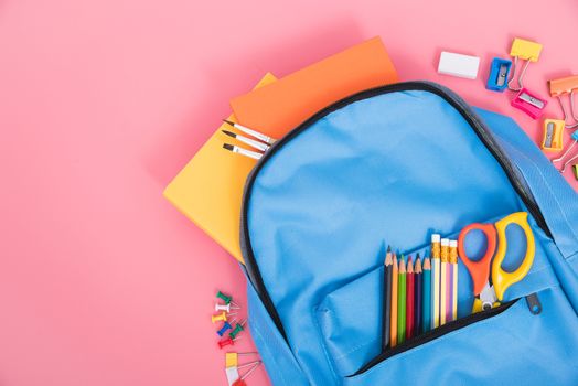 Blue bag backpack for education children on pink background back to school concept