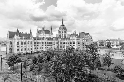 Hungarian parliament building from behind on a sunny day in summer season in Budapest, Hungary - aerial view.