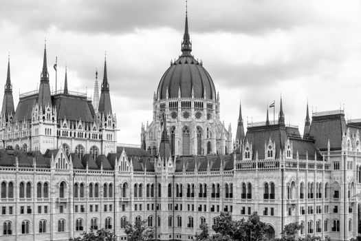 Hungarian parliament building from behind on a sunny day in summer season in Budapest, Hungary - aerial view.