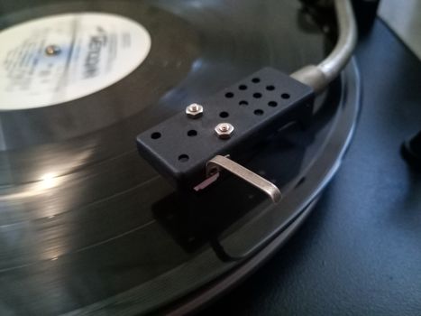 Vinyl player. The plate is on the vinyl player.