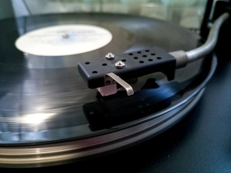 Vinyl player. The plate is on the vinyl player.