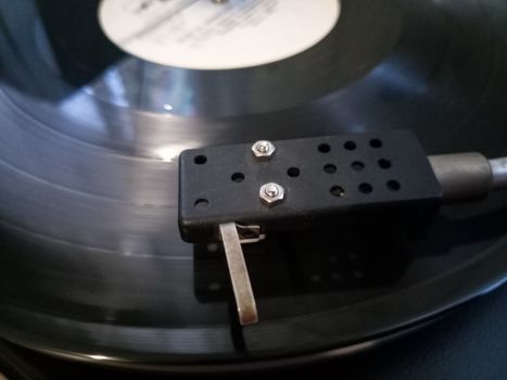 Vinyl player. The plate is on the vinyl player.