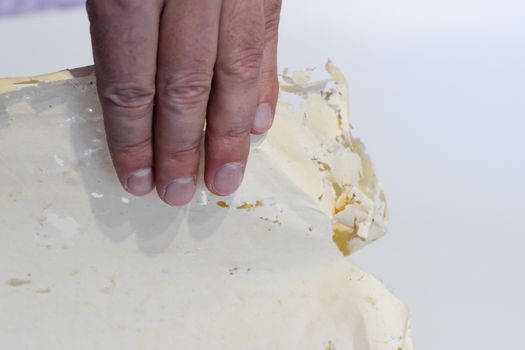 Enveloped with silverfish, envelopes of records in the man's hand. Paper swallowed with silverfish. Traces of wrecking silverfish on vinyl envelopes. lepisma