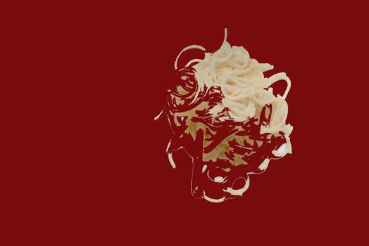 Abstract pasta on a red background
