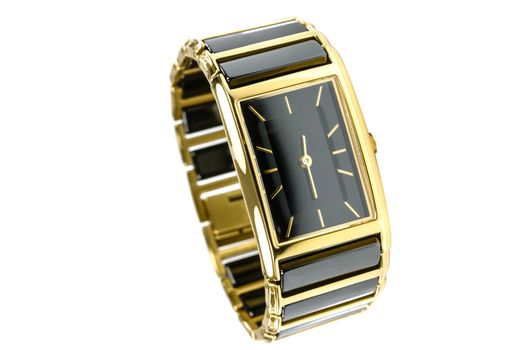 Elegant female gold watch isolated on a white background in close-up